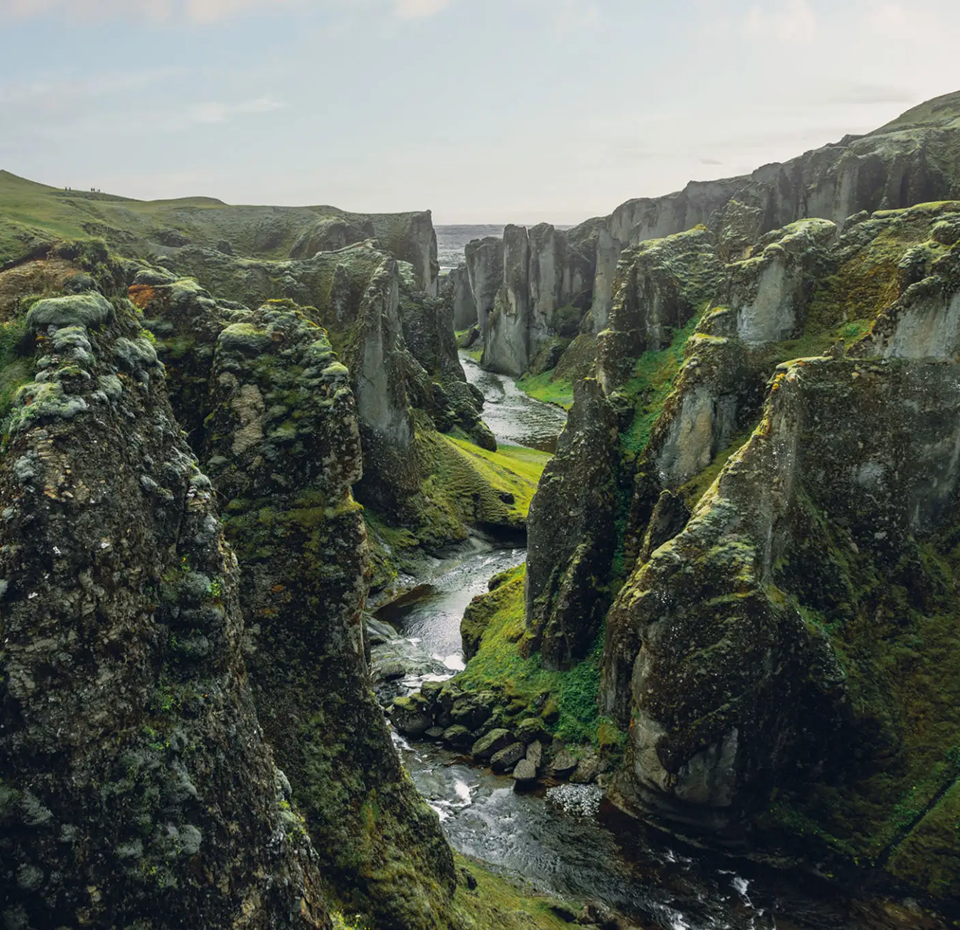 Lush green cliffs and river